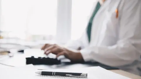 Getty Images Doctor on keyboard