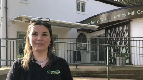 Jo Lane standing in front of the visitor centre