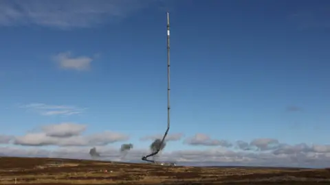 Arqiva The Bilsdale TV and radio mast collapsing as part of the controlled demolition