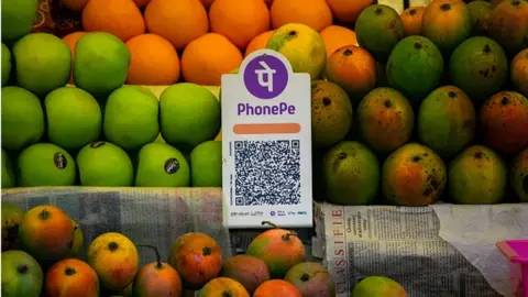 Getty Images A Unified Payment Interface (UPI) barcode, or QR code, is kept at a stall for customers to make digital payments Guwahati, India Friday, April 14, 2023. (Photo by: David Talukdar/UCG/Universal Images Group via Getty Images)