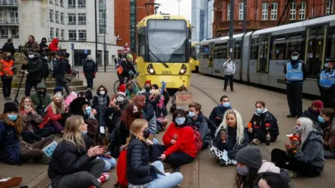 PA Media A protest in Manchester