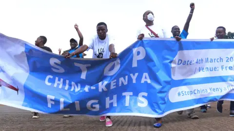 Getty Images People campaigning against Kenya China flights