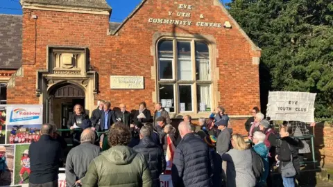 Shariqua Ahmed /BBC Residents outside the community centre