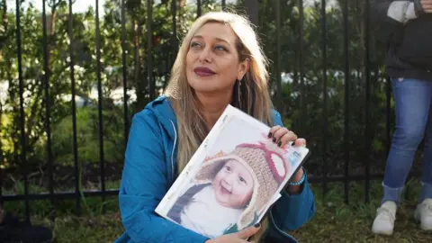 Angelica Casas Vanessa Viana brought a photograph of her son for Mr Bolsonaro to sign