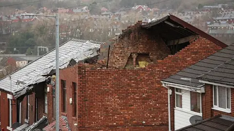 ADAM VAUGHAN/EPA-EFE/REX/Shutterstock Damaged caused to a property by tornado