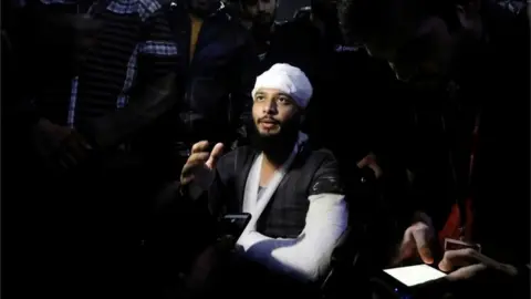 Reuters Hisham Siddiqui, a Jamia Millia Islamia university student, who was injured during a protest on Sunday, talks to media outside a hospital in New Delhi, India, December 16, 2019.