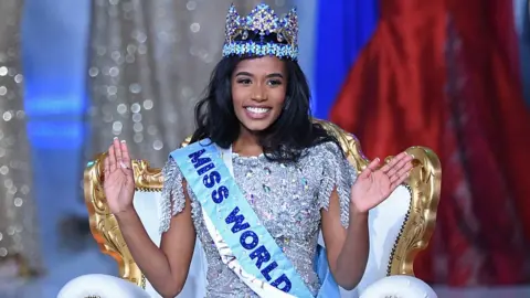Getty Images Toni-Ann Singh with the Miss World crown on