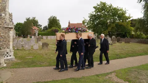 Joe Giddens Bill Turnbull's coffin (says we can't crop this image)