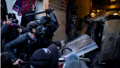Getty Images Police and rioters clashed for hours in the halls of Congress