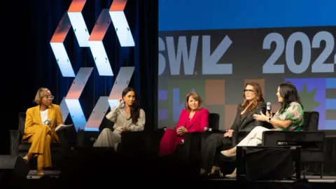 Getty Images Errin Haines, Meghan, Duchess of Sussex, Katie Couric, Brooke Shields and Nancy Wang Yuen speak onstage during the Breaking Barriers, Shaping Narratives: How Women Lead On and Off the Screen panel during the 2024 SXSW Conference and Festival at Austin Convention Center on March 08, 2024 in Austin, Texas. (Photo by Astrida Valigorsky/Getty Images)