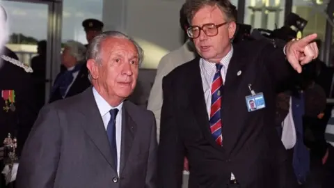 PA Media IOC President Juan Antonio Samaranch (left) and Manchester 2000 Olympic Games bid chairman Bob Scott at Manchester Airport for the start of a two-day visit.