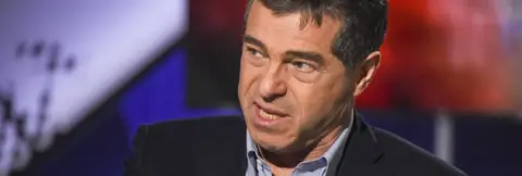 Getty Images Uruguayan economist Ernesto Talvi speaks during a TV interview