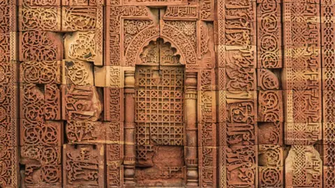 Getty Images Ornate Walls Of Qutub Minar Complex, Delhi, India - stock photo