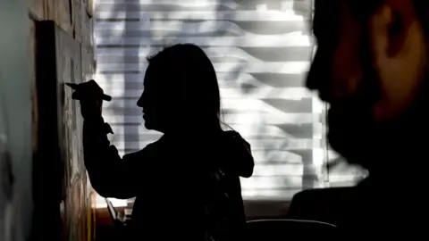 Getty Images Painting a mural