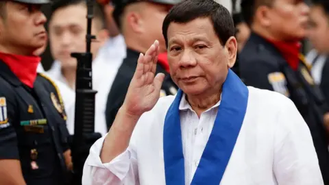 EPA Rodridgo Duterte reviews an honour guard at the Bureau of Customs in Manila, Philippines, 6 February 2018