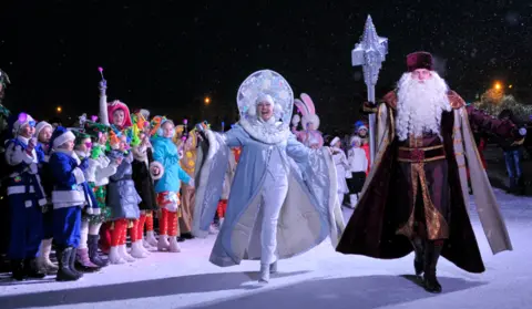 DANIL SEMYONOV/AFP/Getty Image Grandfather Frost and the Snow Maiden mark New Year in Stavropol, Russia