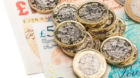 Getty Images Pound coins and notes