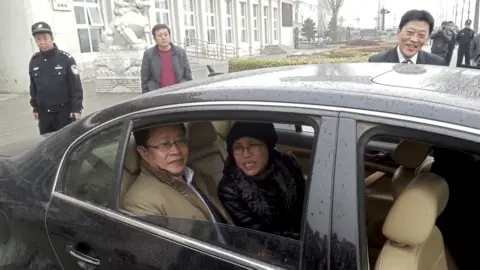 AFP Nobel Peace Prize laureate Liu Xiaobo's wife, Liu Xia (C), together with human rights lawyer Mo Shaoping (L), arrive at the court for the trial of her brother, Liu Hui, who is charged for committing fraud in connection with a real-estate deal, in Beijing on April 23, 2013.