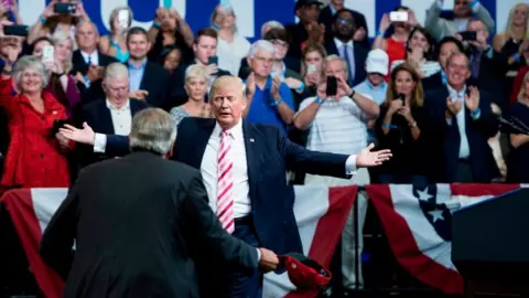 Getty Images Donald Trump moves to hug Luther Strange in Huntsville