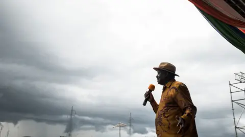 Getty Images Opposition candidate Raila Odinga speaks to the crowd gathered at a rally at the Ogango Grounds on October 20, 2017 in Kisumu, Kenya. Tensions are high as Kenya waits for a new Presidential vote after it annulled the results of the first vote in August. Opposition candidate Raila Odinga has rejected the new election, saying a free and fair election was not currently possible in Kenya