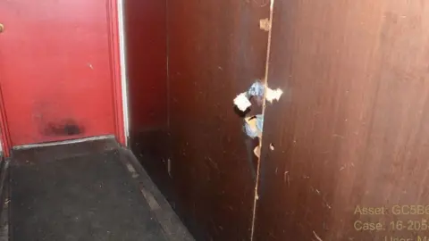 Court filing Bullet holes where Welch fired at the locked cabinet