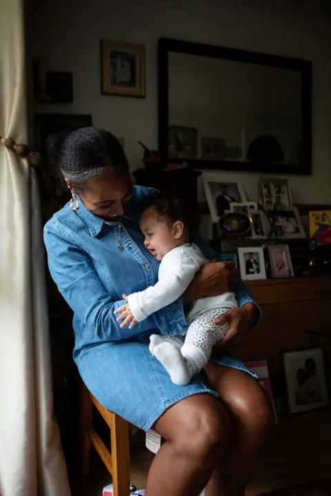 Nina Raingold A portrait of Naomi with her baby Akirou