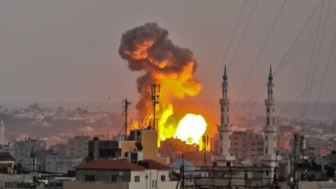 AFP A picture taken on July 20, 2018 shows a fireball exploding in Gaza City during Israeli bombardment. Israeli aircraft and tanks hit targets throughout the Gaza Strip on July 20