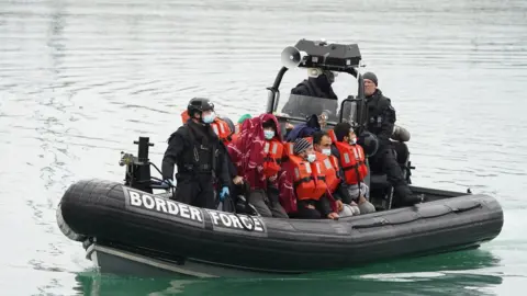 PA Media People thought to be migrants in Border Force vessel are brought in to Dover on 20 November 2021