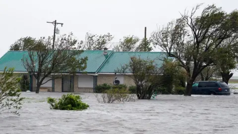 Reuters Floodwaters outside a house in Port Lavaca