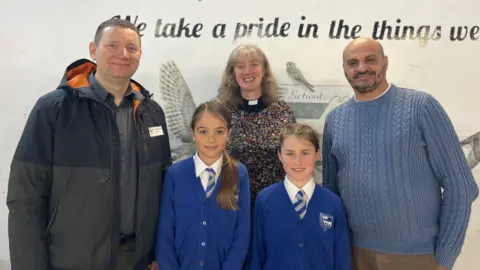 BBC Toader Sarbu, The Reverend Helen Gunton and Alex Stroie with Year 5 pupils Clara and Annie
