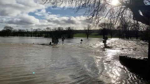 Llechryd bridge completely submerged by the River Teifi