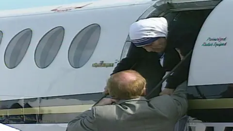 Mother Teresa arriving at Swansea Airport in 1996