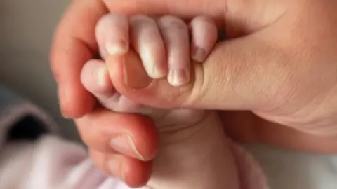 Getty Images Baby's hand