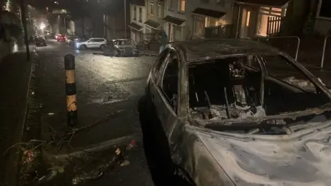 Burned out cars in Mayhill