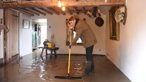 PA Media A flooded home in Cossington, Leicestershire