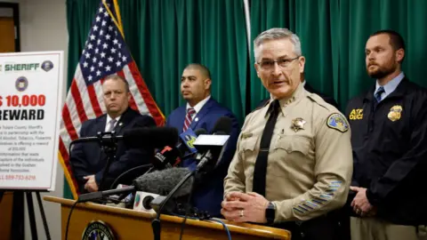 Los Angeles Times via Getty Images Tulare County Sheriff Mike Boudreaux at a January press conference