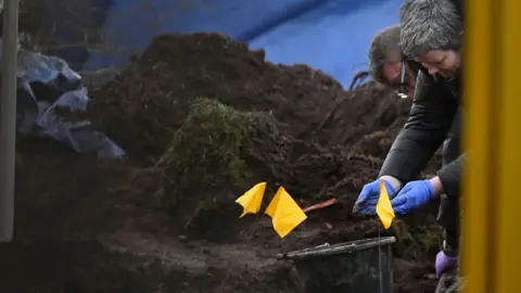Getty Images Police searching the garden