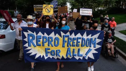 AFP Abortion rights activists march to the house of US Supreme Court Justice Brett Kavanaugh