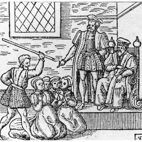 Hulton Archive A group of supposed witches being beaten in front of King James I (King James VI of Scotland)