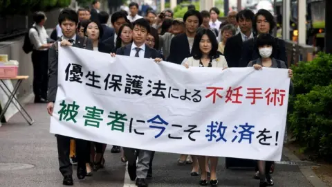 Getty Images Protest against forced sterilisation or eugenics law in Japan