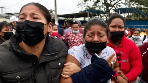 Getty Images relatives wait outside prison after latest violence