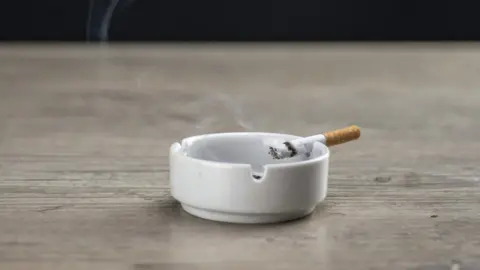 Getty Images A cigarette in an ash tray
