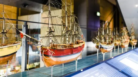 Paolo Busato/Sydney Living Museums Models of ships from early British settlement in Australia on display at a museum in Sydney