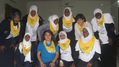 Handout Sham and leader Rim with Girl Guides in Sudan