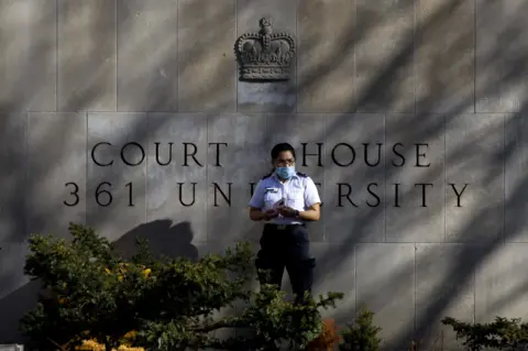 Getty Images Guard outside court room