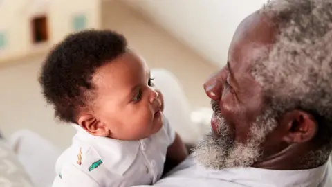 Getty Images Baby and granddad