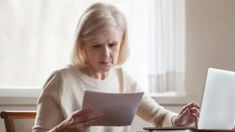 Getty Images Woman frustrated with domestic bill