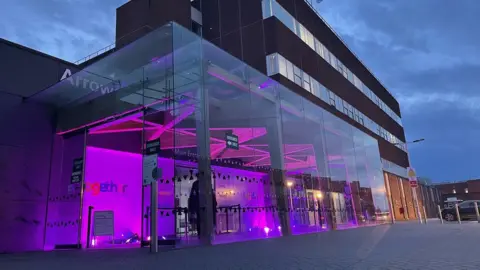 WUTH Arrowe Park Hospital lit up to mark anniversary of arrival of first Covid quarantine cases
