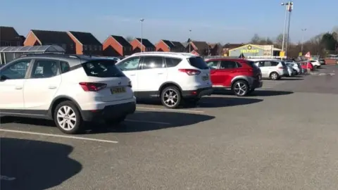 Kassi McFarlane Ellis Cars spaced out at a supermarket