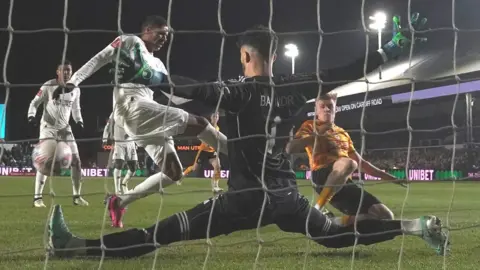 PA / Nick Potts Will Evans scores Newport's second to bring the game level against Manchester United